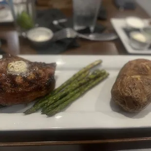 Porkchop meal with asparagus and baked potato