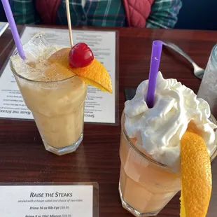 A creamsicle on right.  A Painkiller on left.