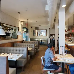 a man sitting at a table in a restaurant