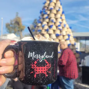 a person holding a cup of coffee