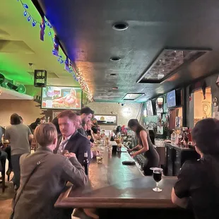 a group of people sitting at a bar