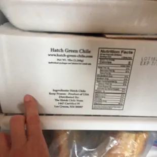 a person reaching for a bagel