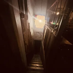Staircase leading to upstairs seating.