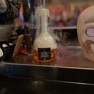 a skull and a bottle of booze