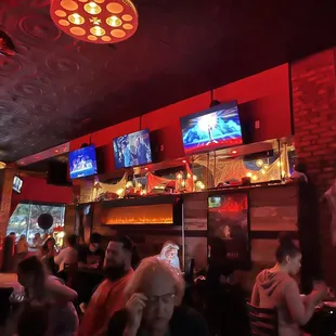 a crowd of people in a bar
