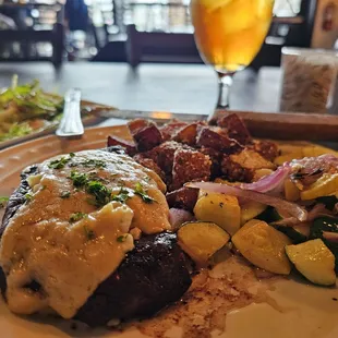 Steak perfection with crispy potatoes and zucchini.