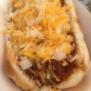 Chili mac dog - Chili, mac &amp;a cheese, onion, mustard, cheddar jack cheese. Add jalapeño and sour cream if you like