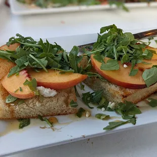 Havenly Bruschetta made with peaches and spicy honey.