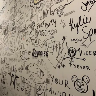 a wall covered in graffiti