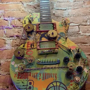 a guitar with a lot of stickers on it