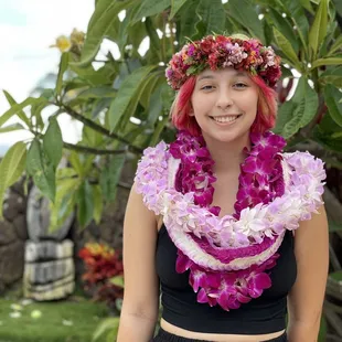 The dark purple and light purple orchid lei were made by Hawaiian Lei Company