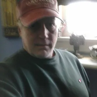 a man wearing a hat and glasses