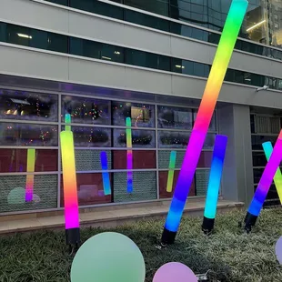 a colorful sculpture in front of a building