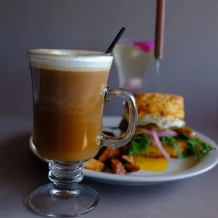 a cup of coffee and a plate of food