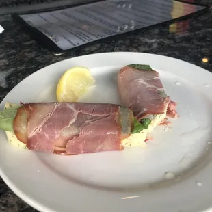 Havarti cheese wrapped in prosciutto with basil