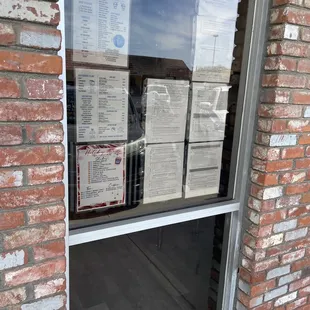 pizza boxes in a window