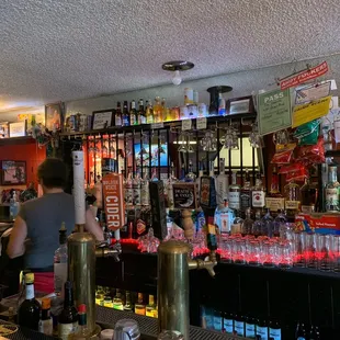 a bar filled with bottles of alcohol