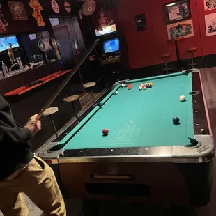 a man playing a game of pool
