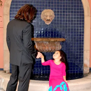 Father and daughter by the lion fountain. JJ &amp; Juliet.