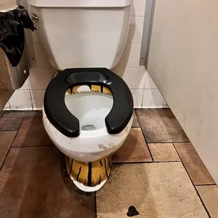 a toilet in a public restroom