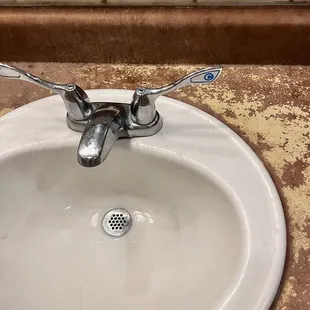 a bathroom sink with a drain