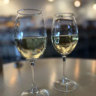 two glasses of wine on a table
