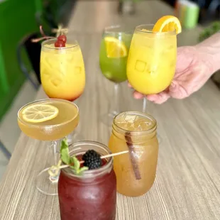 four different drinks on a table