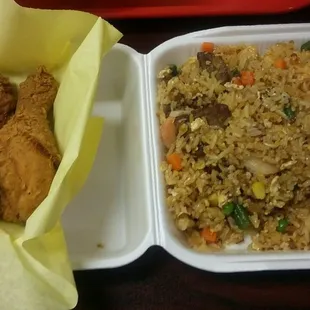 Combination fried rice with two chicken legs.