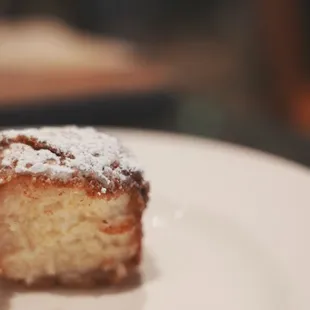 Warm Made-to-Order Beignets. Crunchy exterior with a dense, but spongy interior. Reminds me of a dense donut hole.