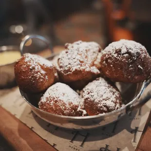 Warm Made-to-Order Beignets. Crunchy exterior with a dense, but spongy interior. Reminds me of a dense donut hole.