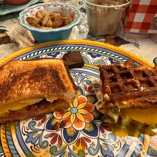 Honey butter grilled cheese and jalapeño popper with side of potatoes and a delicious piece of chocolate for after the meal.