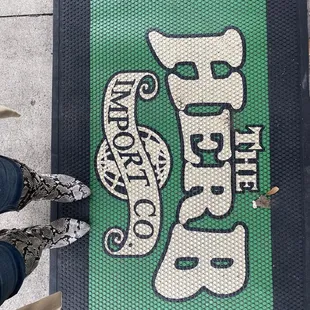 a person standing in front of a sign