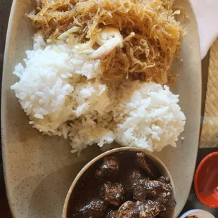 Two item plate with pancit and dinuguan.