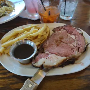 a plate of meat and french fries