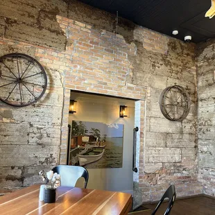 a dining room with brick walls