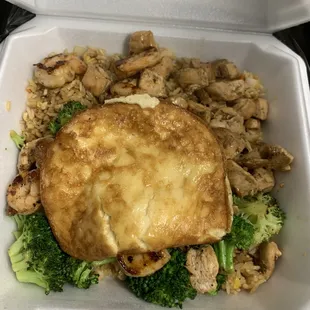 a chicken and broccoli dish in a styrofoam container
