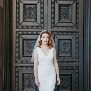 A bride in front of one of The Hibernia's front doors