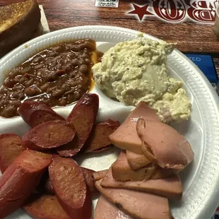 Hot links, bologna and spicy beans and potato salad