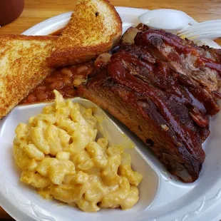 Two meat special. Ribs and shredded pork. Sides mac n cheese and spicy BBQ beans.