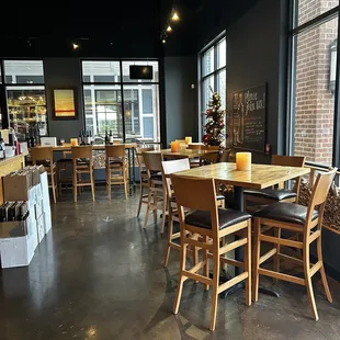 a dining area with tables and chairs