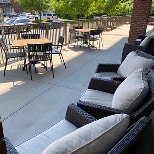 a patio with a table and chairs