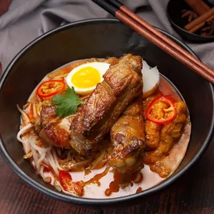 Laksa is a rich and spicy coconut soup that goes well with the super tender pork ribs!