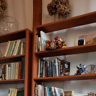 There's what appears to be a camera on the shelf just watching over everyone