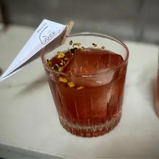 two glasses of water and a paper plane