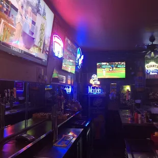 a bar with neon signs