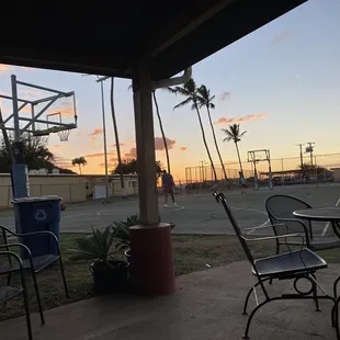 a basketball court at sunset