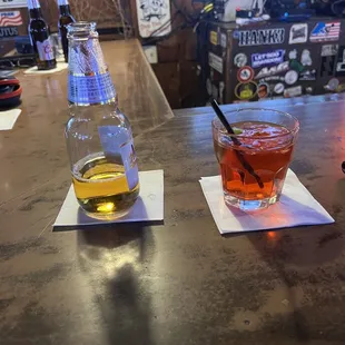 a drink and a beverage on the bar
