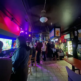 a group of people at a bar