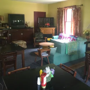 Sweet little lounge area that has the feel of being in someone&apos;s living room. AWESOME