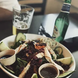 a plate of food and a glass of beer